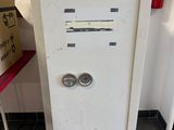 a white cabinet with two doors and a pair of eyes on it