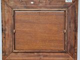 an old wooden picture frame with a picture hanging on it ' s side