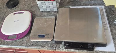 a picture of a kitchen counter top with a scale and a food processor