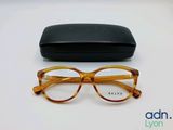 the glasses are next to the case on the table