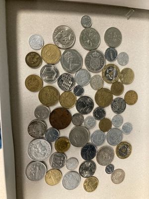 a picture of a shadow box with coins in it