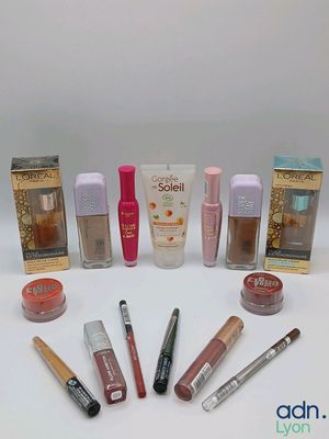 the contents of various cosmetics products are arranged on a white surface