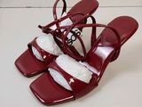 the red shoes are on a white surface with a white background