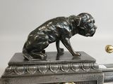 bronze figurine of a dog on a marble base