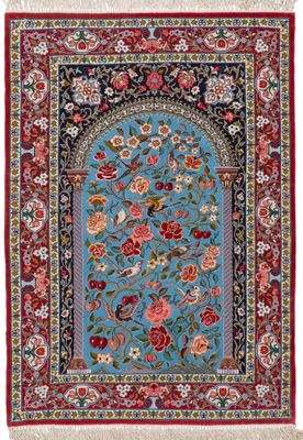 un tapis bleu à bordure rouge et à motifs floraux