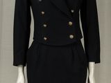 an image of a black dress and jacket on a mannequin