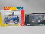 two toy vehicles that are sitting next to each other