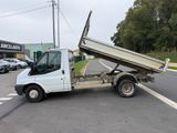 a white truck that is parked on the side of the road
