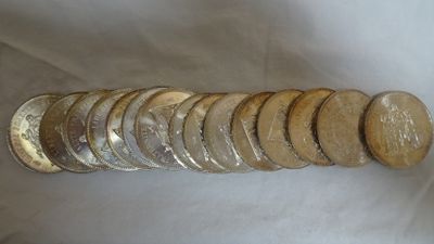a pile of coins sitting on top of a white table