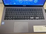 a laptop that is sitting on a desk with a blue screen