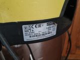 a yellow helmet that has a sticker on the side of it