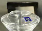 a clear glass bowl with a blue sticker on it