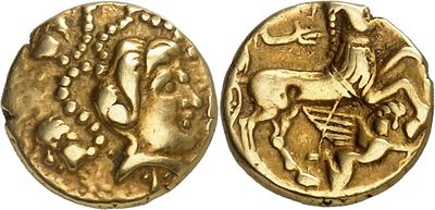 a gold coin with an image of a man on a horse