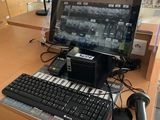 a desktop computer sitting on a desk with a keyboard and mouse
