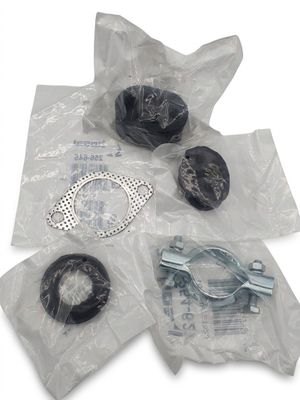 four pieces of plastic wrapped in plastic bags on a white surface
