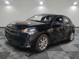 a picture of a black car in a showroom