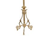 an image of a tall candle holder with a candle on it