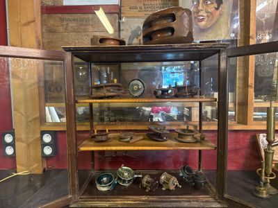 a display case with a lot of items inside of it