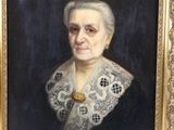 portrait of an old woman in a black dress with a white lace collar