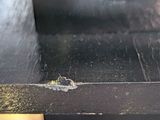 a close up of a piece of wood with a hole in it