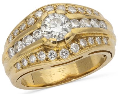 a close up of a gold ring with diamonds on it