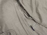 a close up of a jacket with a zipper on it