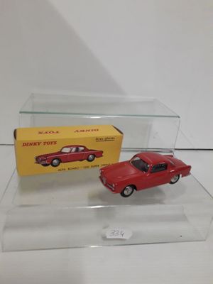 an image of a red toy car sitting on top of a clear display case