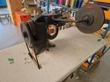 a sewing machine that is sitting on a table