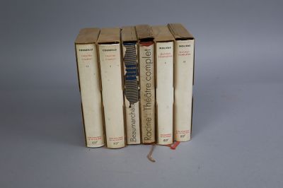 three books are stacked on top of each other on a table