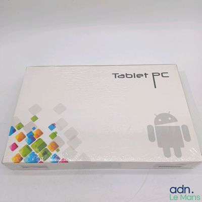 a tablet pc sitting on top of a white table