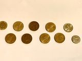 a lot of coins that are on the table
