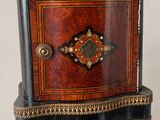a small wooden box with a decorative decoration on it