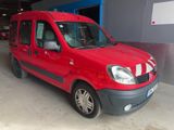 a red van that is parked in a garage