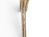 a close up of a metal spoon on a white surface