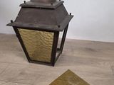 a lamp that is sitting on the floor next to a rug