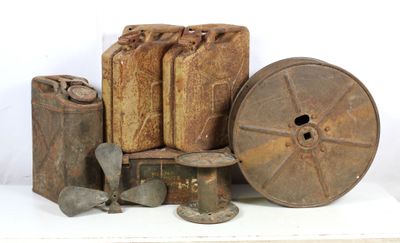 a pile of old metal items sitting on a table