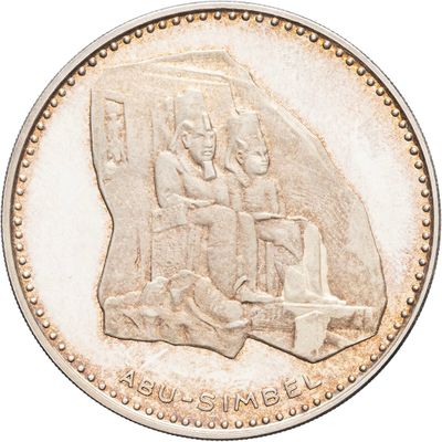 an image of a coin with a picture of a man and a woman on it