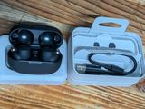 a pair of earphones in a case on a table