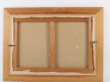 a close up of a picture of a window frame on a wall