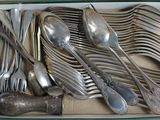a box of silverware that is sitting on a table