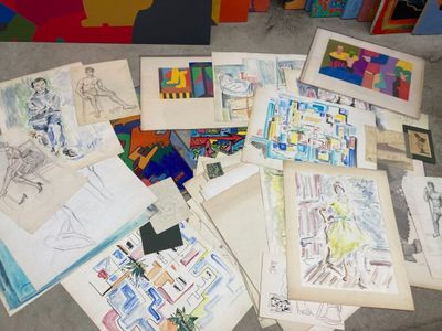 a lot of drawings on the floor next to each other