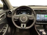 a picture of the interior of a car with a steering wheel and dashboard