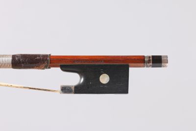 a close up of a violin bow on a white background