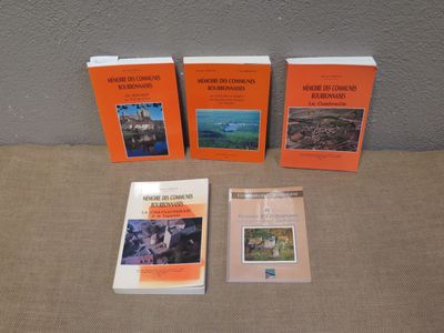three books are sitting on a table next to each other