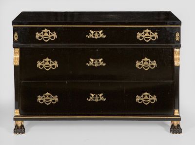 a black and gold chest of drawers with four drawers