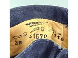 the back of a pair of blue jeans with a yellow label on it