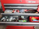 a red tool chest with many items in it
