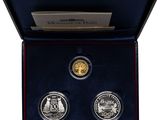 a box with two coins and a certificate on it