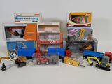 many different types of toy trucks and construction equipment