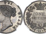 a close up of a coin with a crown on it